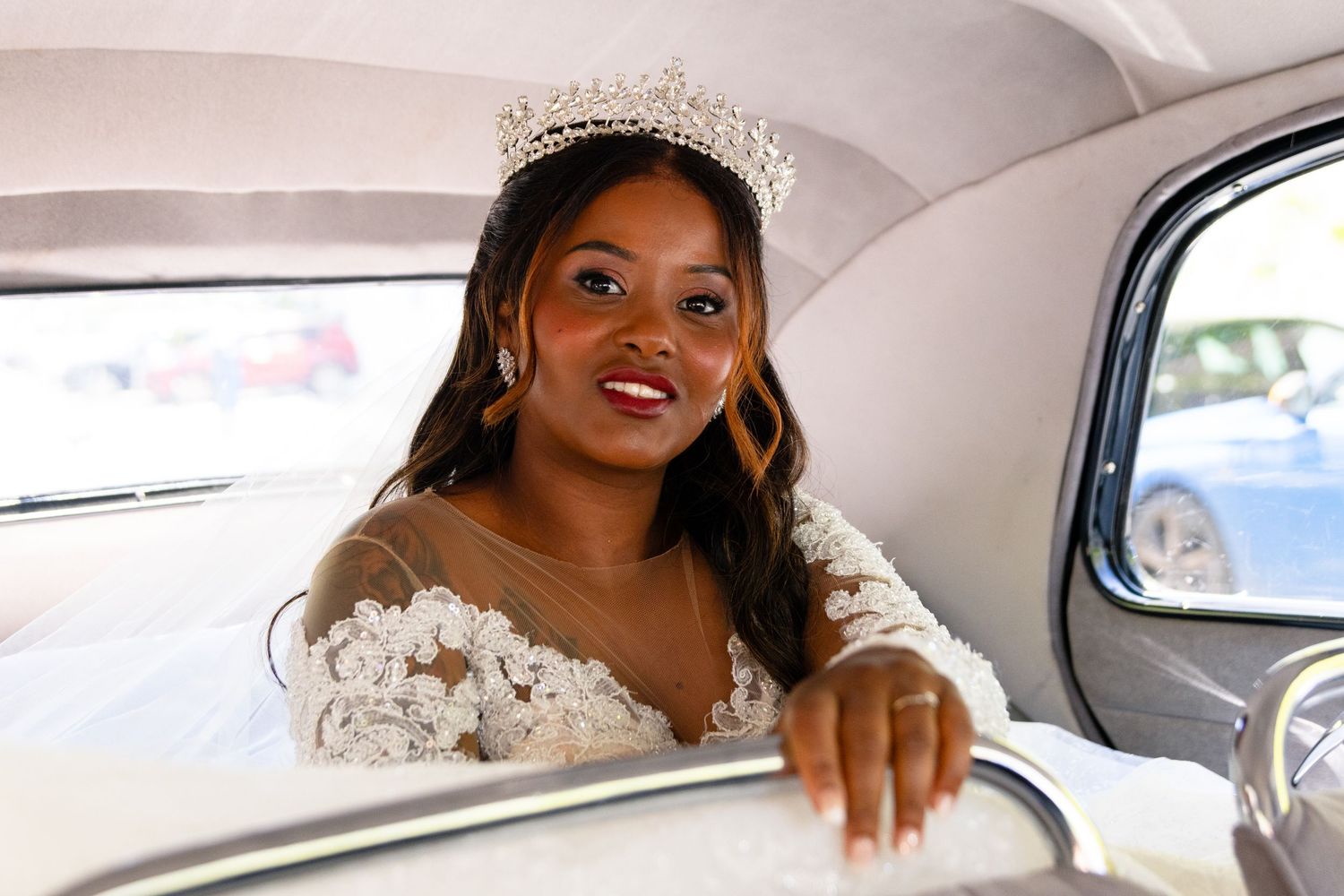 Elegant bridal portraits taken inside a classic car.