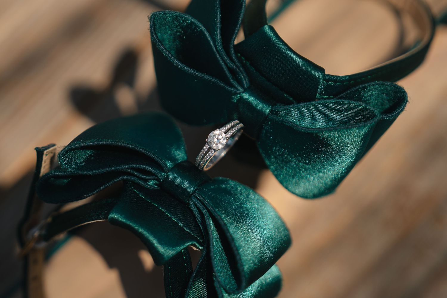Elegant emerald green velvet wedding shoes photographed in detail.