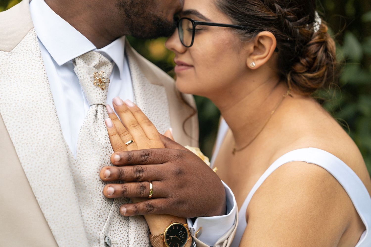 A tender moment shared between a couple on their wedding day.