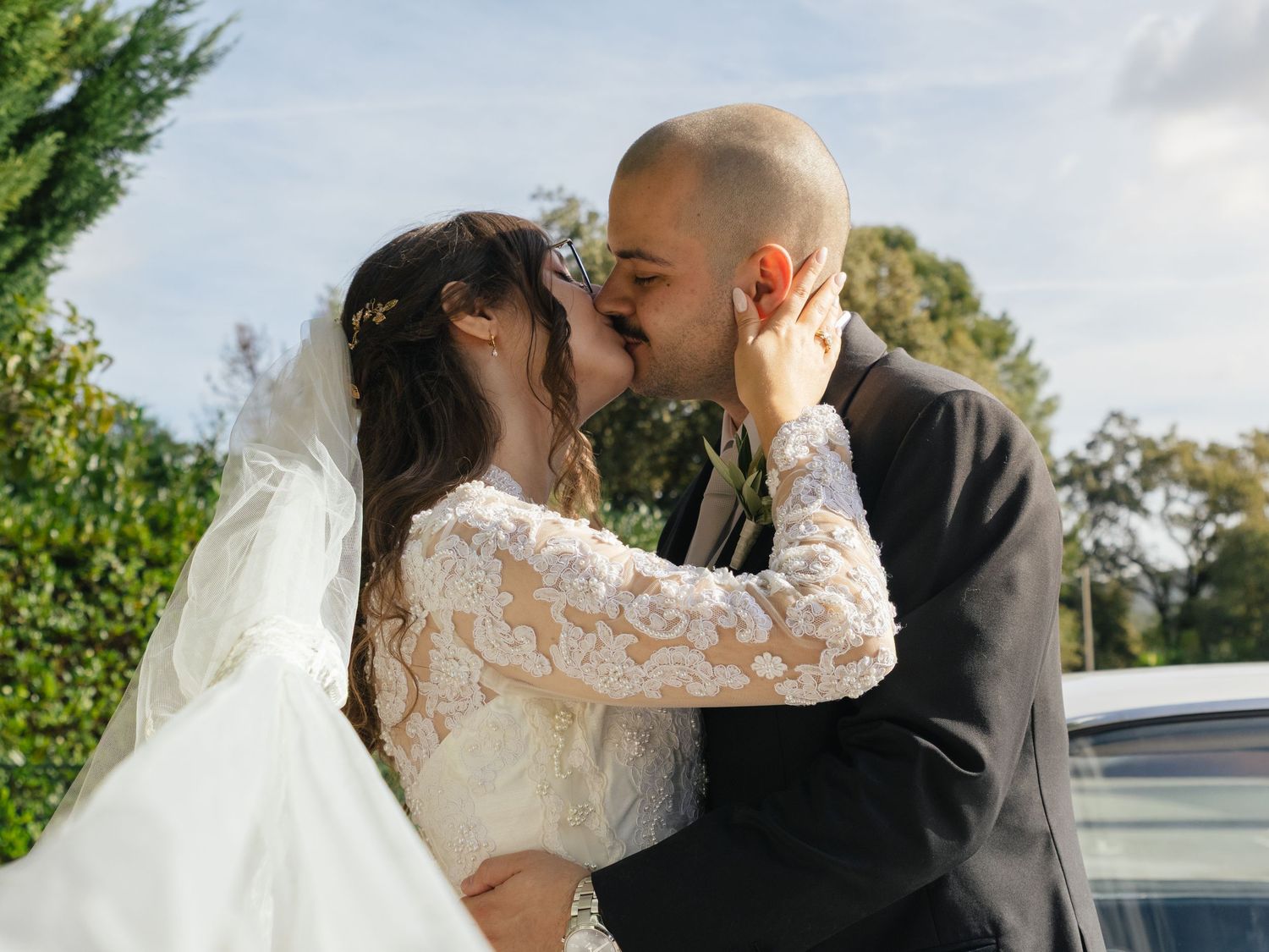 Romantic outdoor wedding photography sequence capturing tender moments between newlyweds.