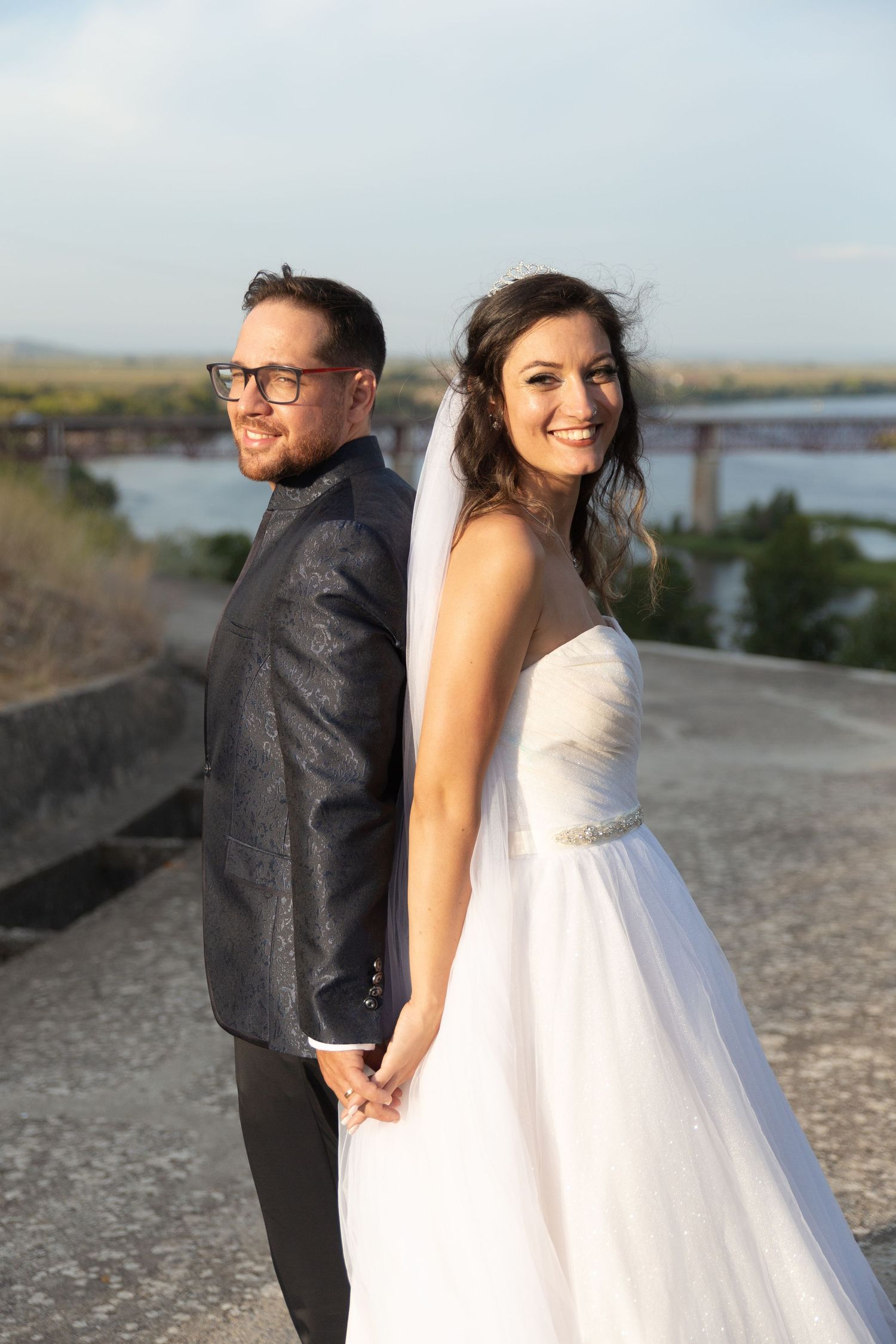 A romantic wedding photo sequence showing a couple posing together against a waterfront backdrop at sunset.