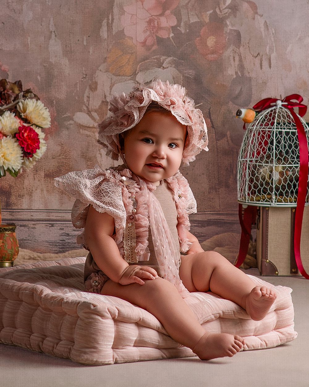 A collection of vintage-style studio portraits featuring soft pink tones, decorative birdcages, and delicate lace details.