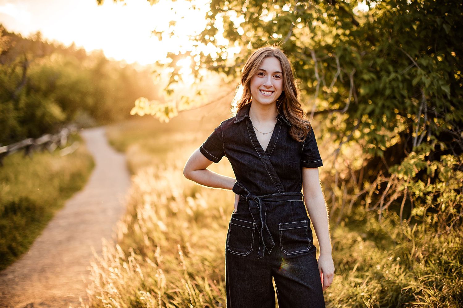 Sara Prue Photography captures the spirit of youth in this stunning high school senior portrait at golden hour.