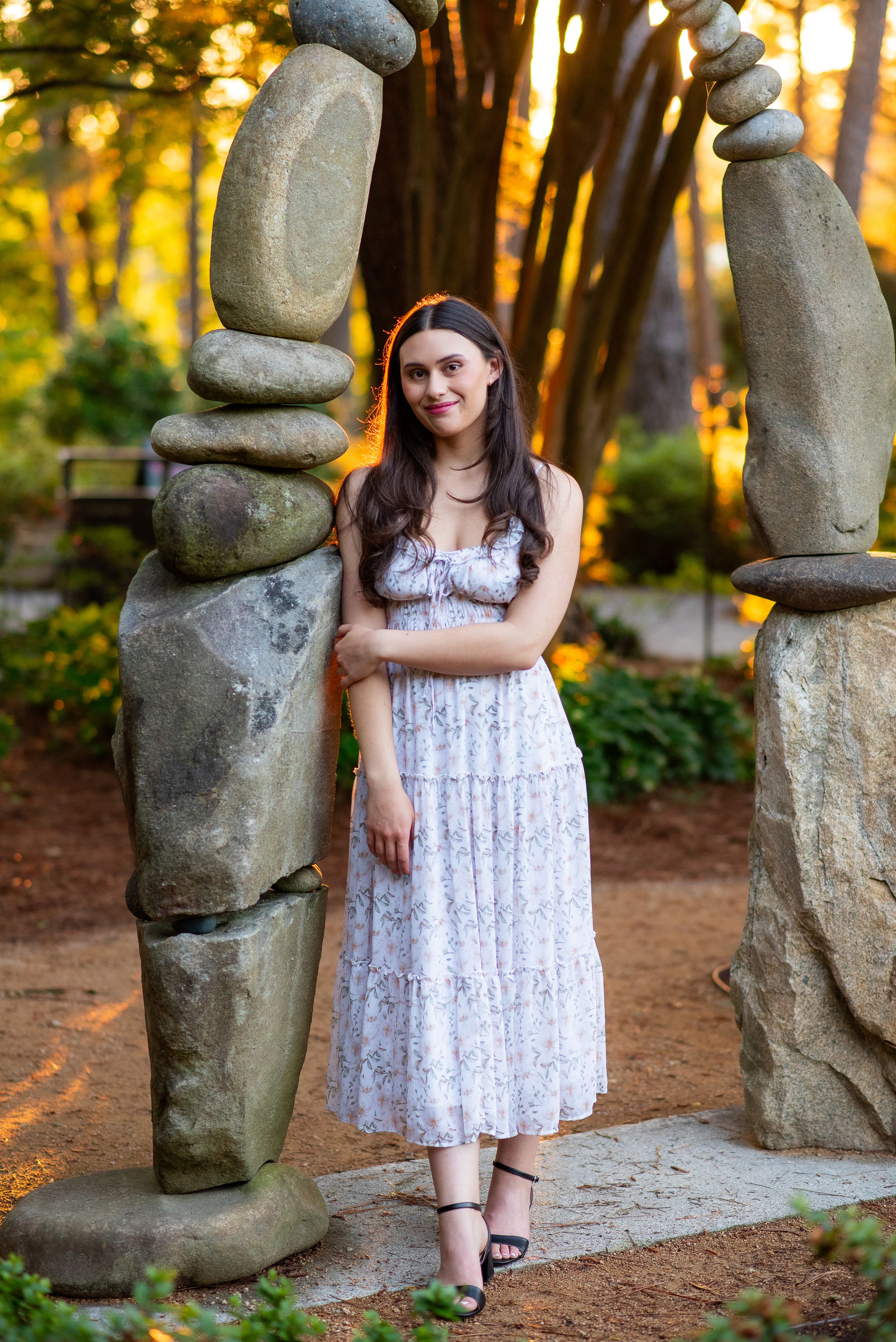 highschool senior at golden hour in WRAL gardens in the Spring time.