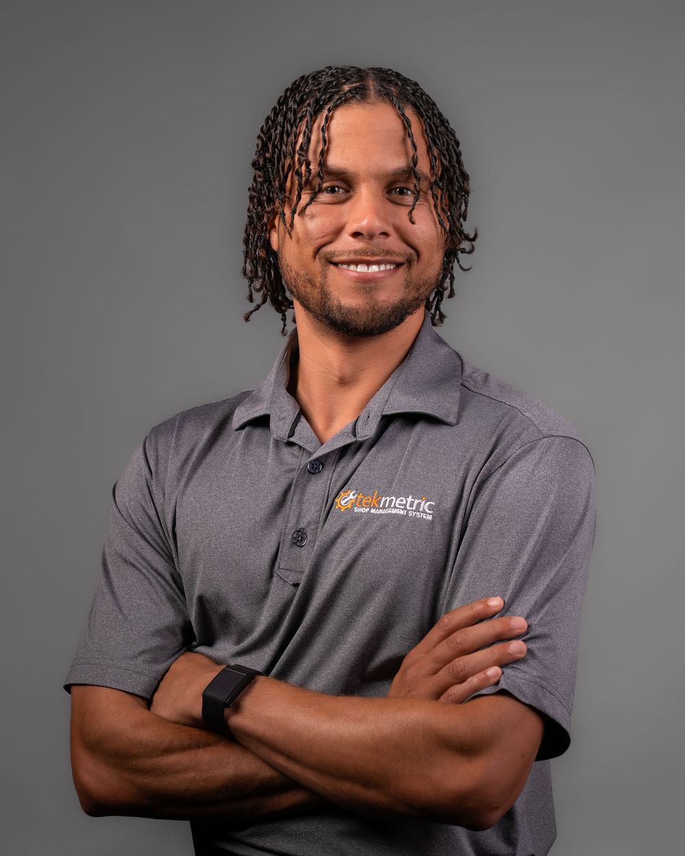 Professional studio portraits show subject in gray polo shirt with progressive poses against gray background.