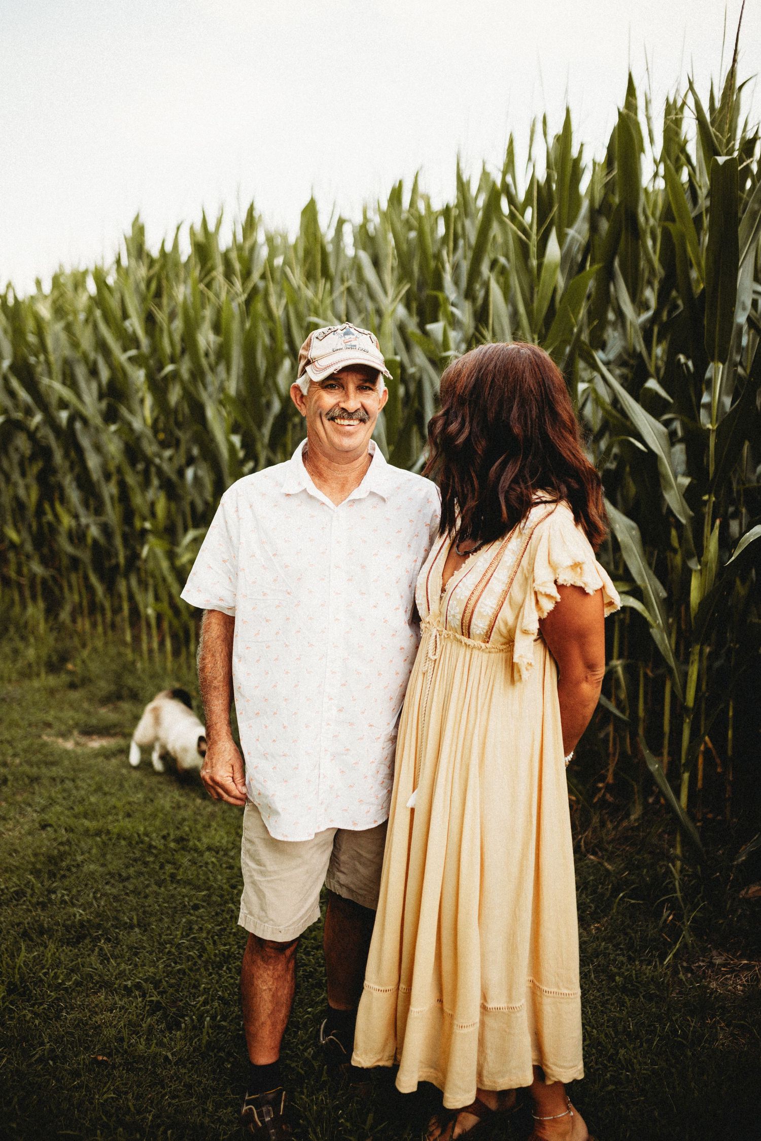 Couple next to a corn field