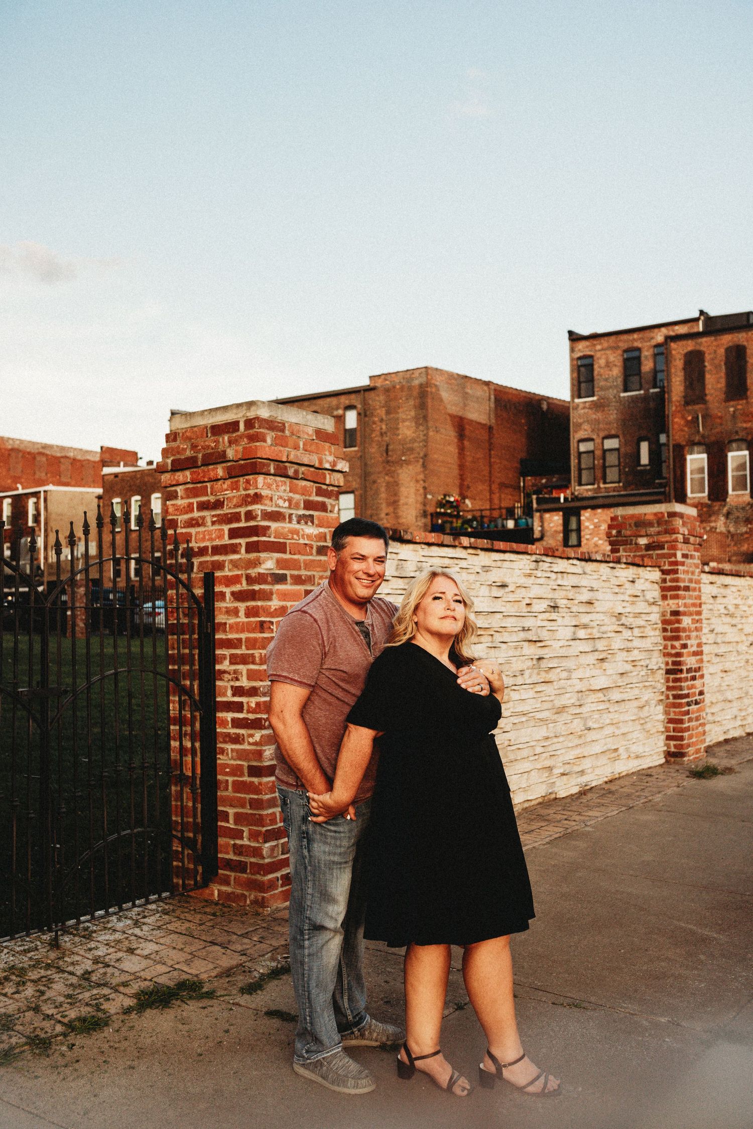 Couple standing next to each other in a downtown setting