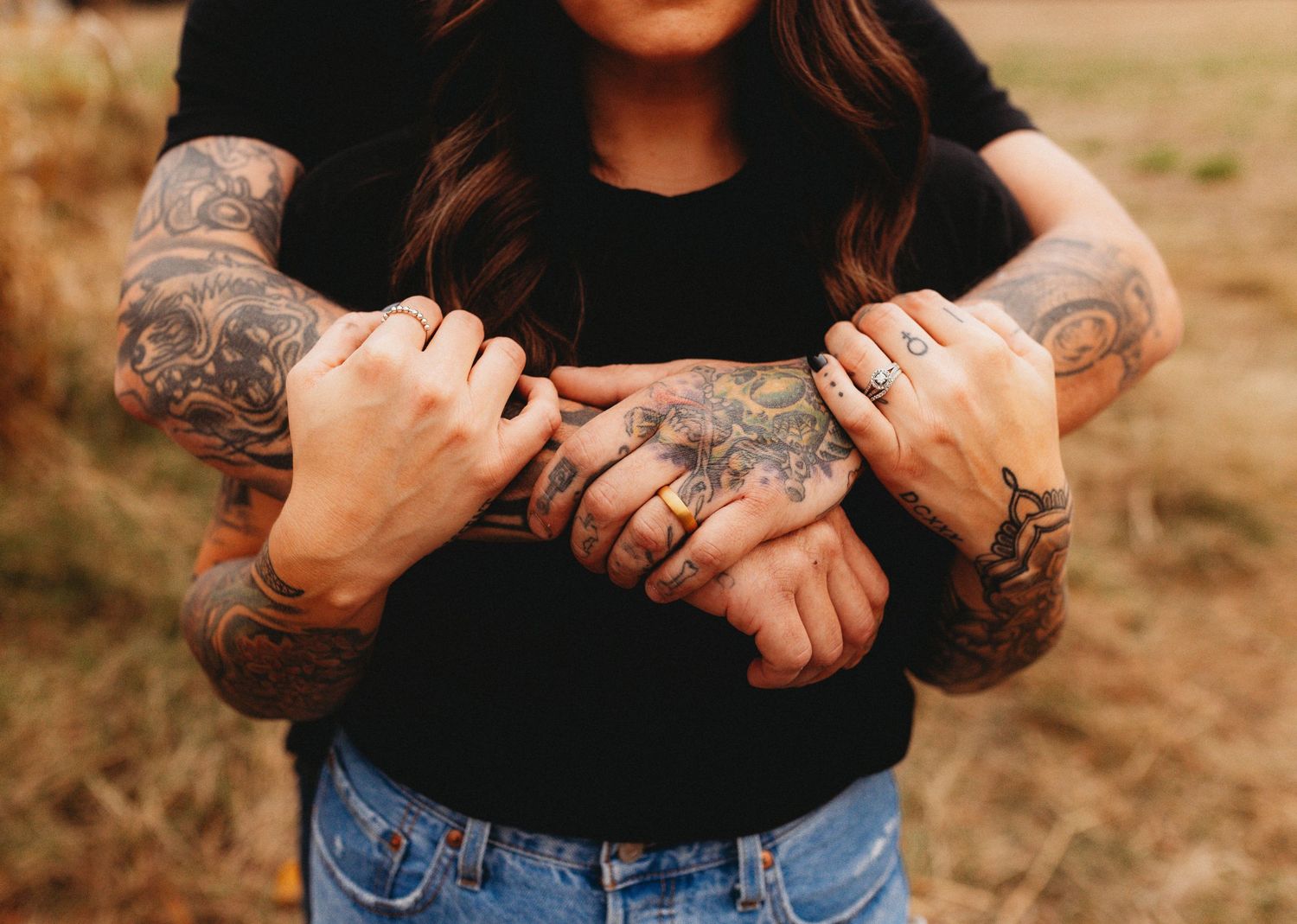 Couple with arms wrapped around each other