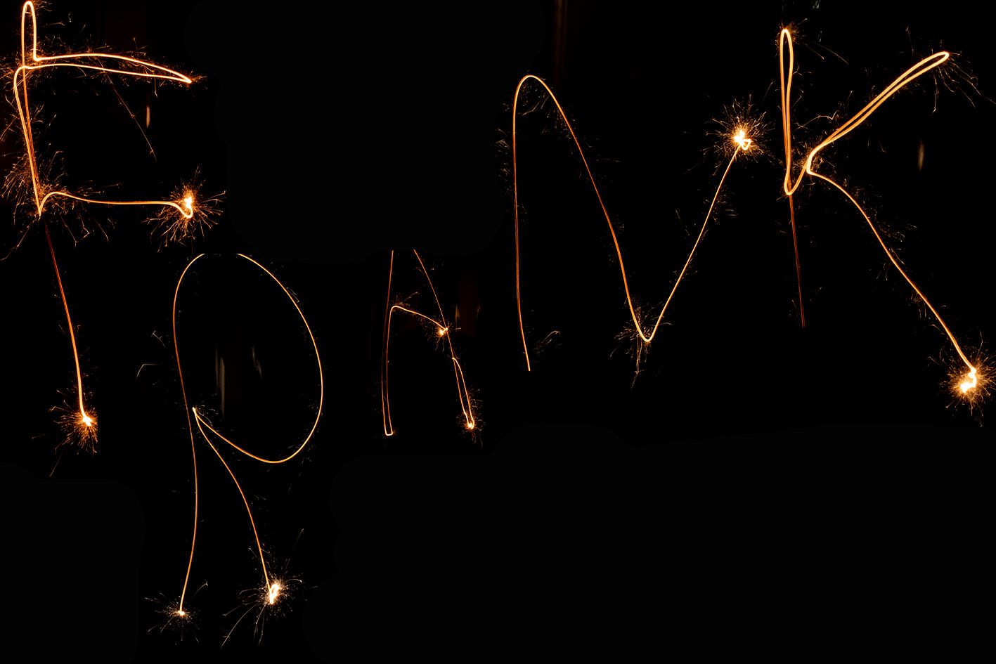 The word 'SPARK' written in light painting against a black background.