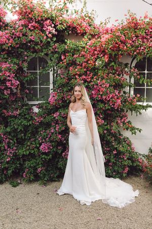 Bride portraits in front of the bougainvillea at La Cotte in Franschhoek