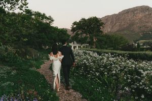 Bride and groom portraits at La Cotte in Franschhoek with mountain views