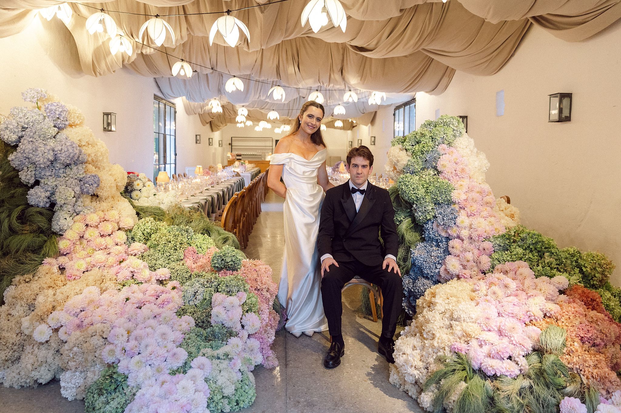 Bride and groom indoor portraits at La Cotte in Franschhoek filled with flowers