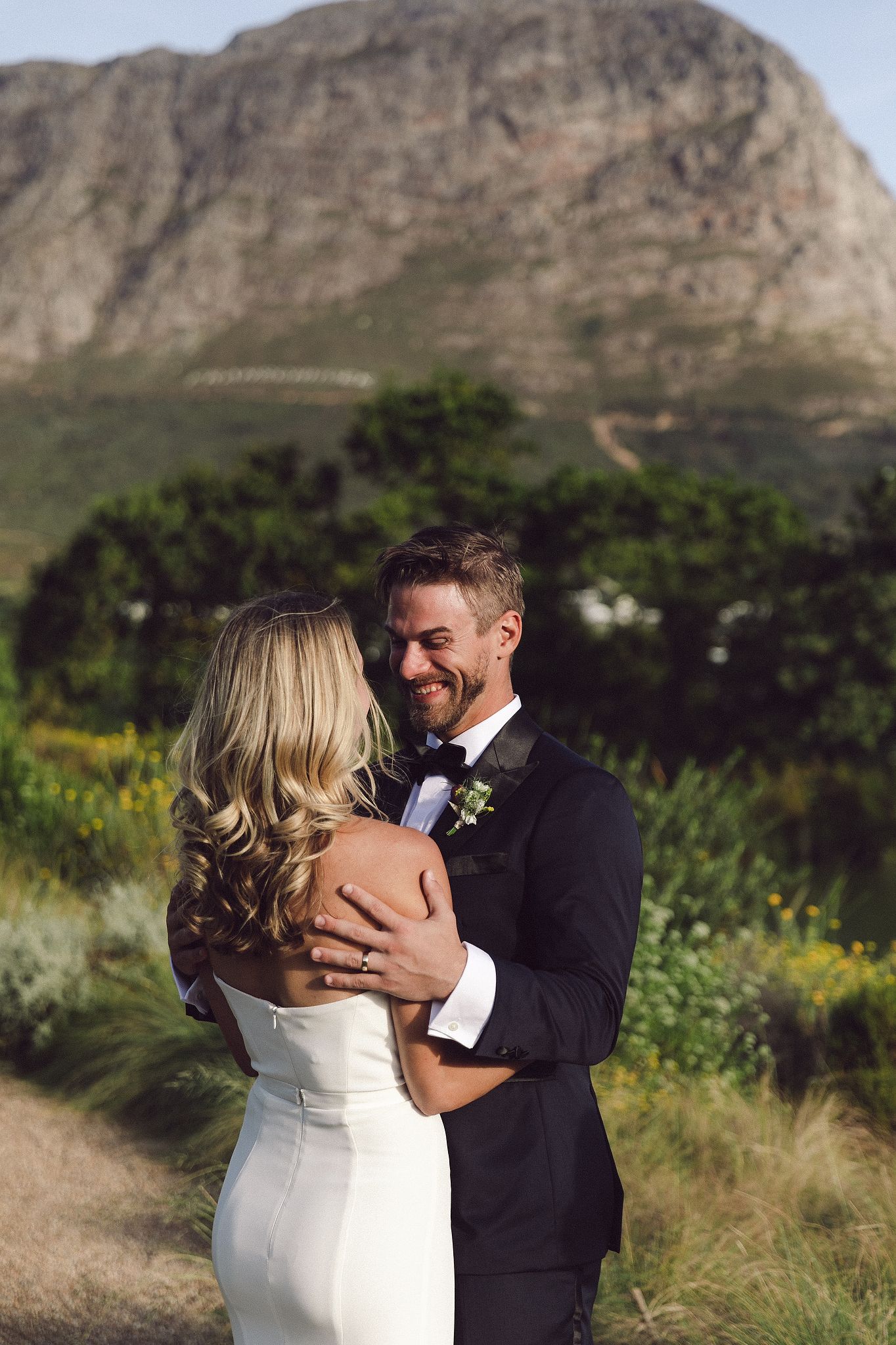Bride and groom portraits at La Cotte in Franschhoek with mountain views