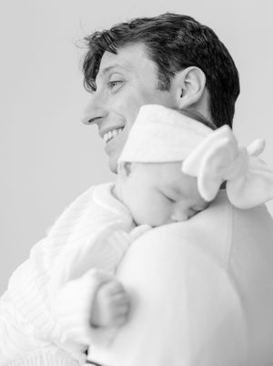 A series of photographs shows someone being wiped with white towel or tissue against a light gray background.