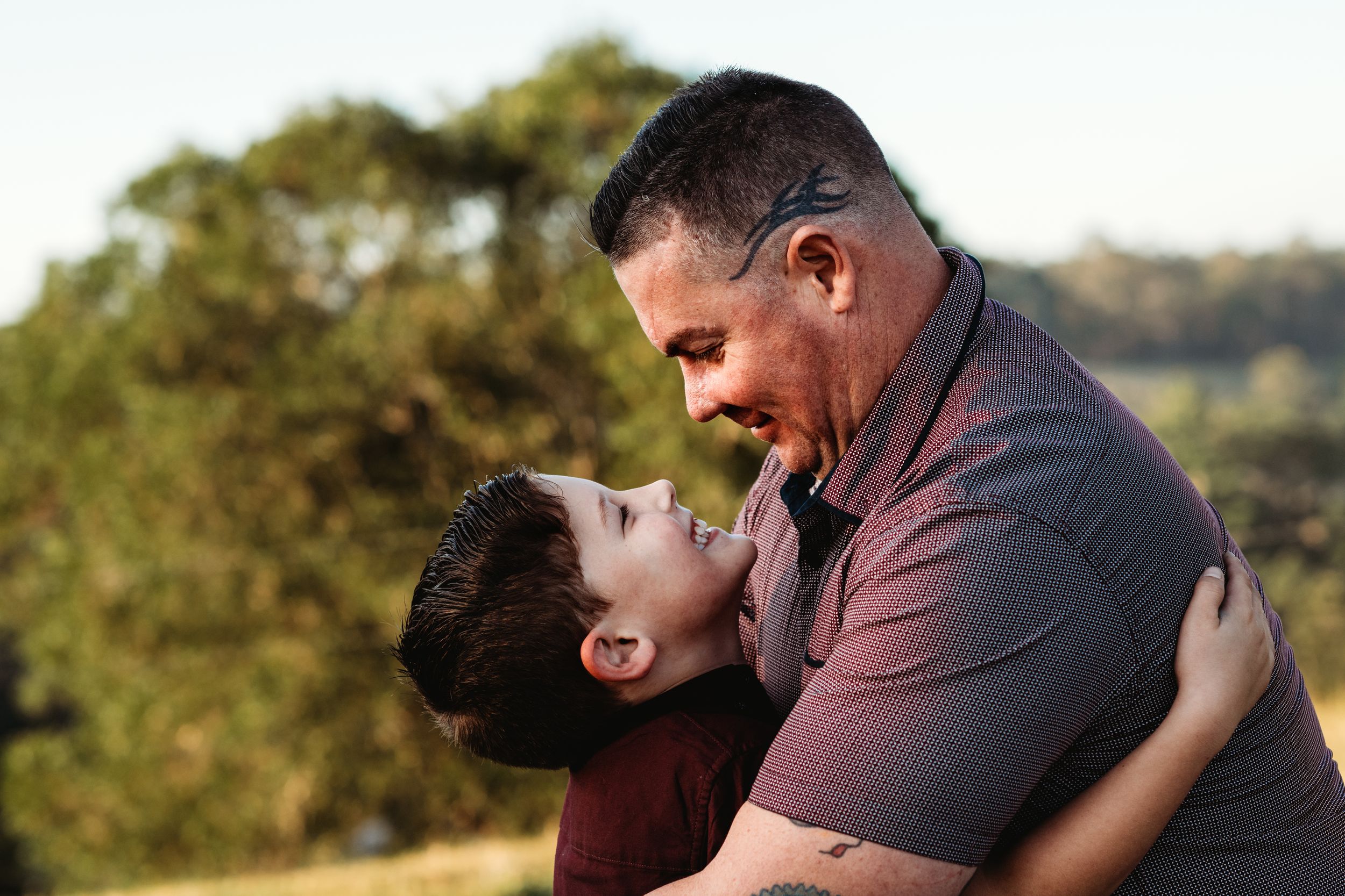 Playful interaction captured during golden hour in an outdoor setting.