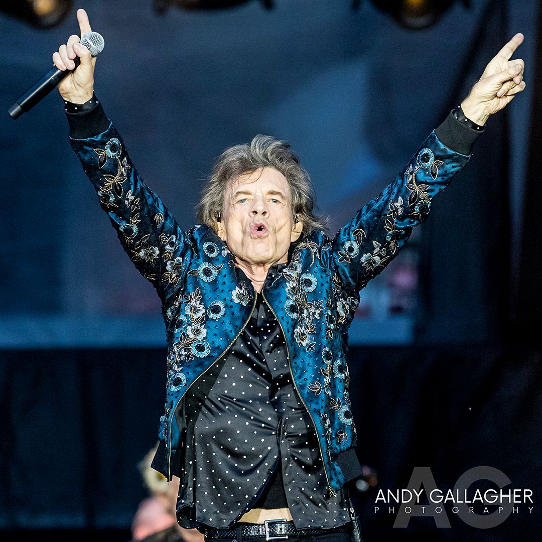 Live music photograph of The Rolling Stones performing on a stadium stage with dramatic lighting by Andy Gallagher