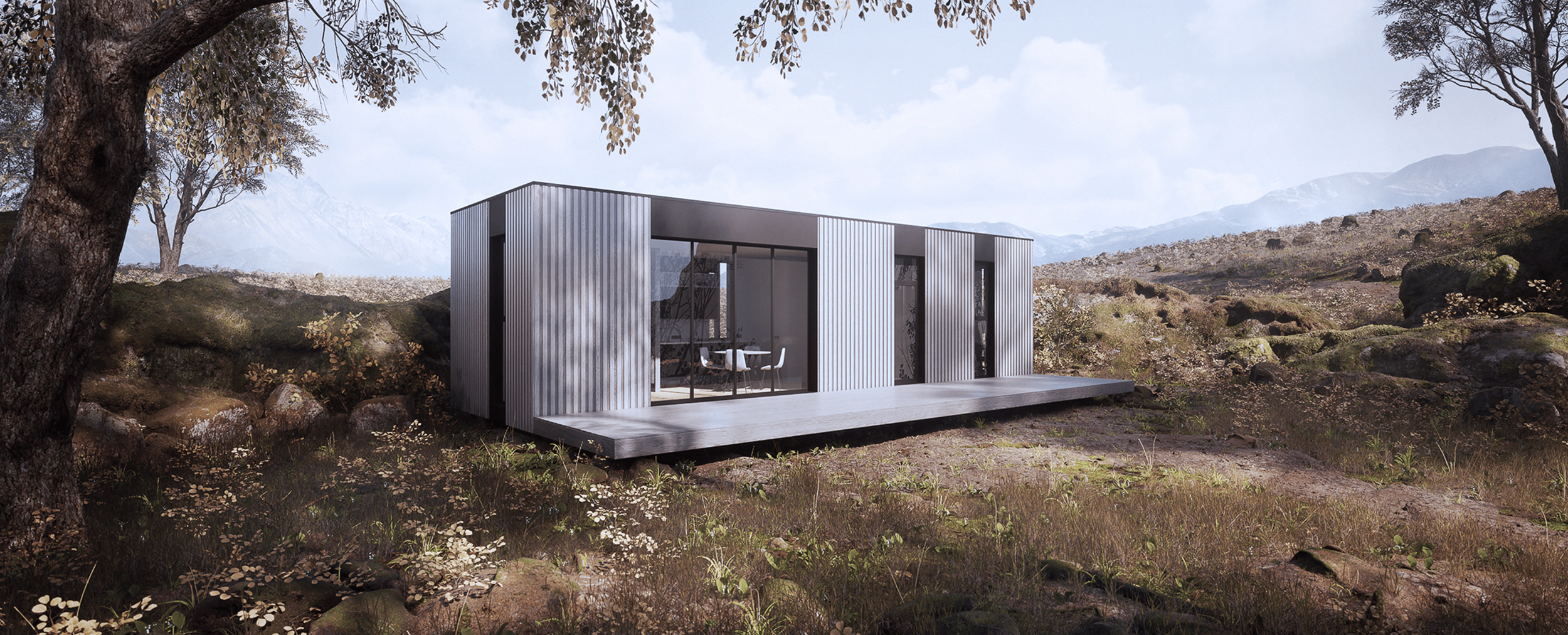 Modern modular homes nestled into a scenic hillside surrounded by rugged desert terrain and sparse vegetation.