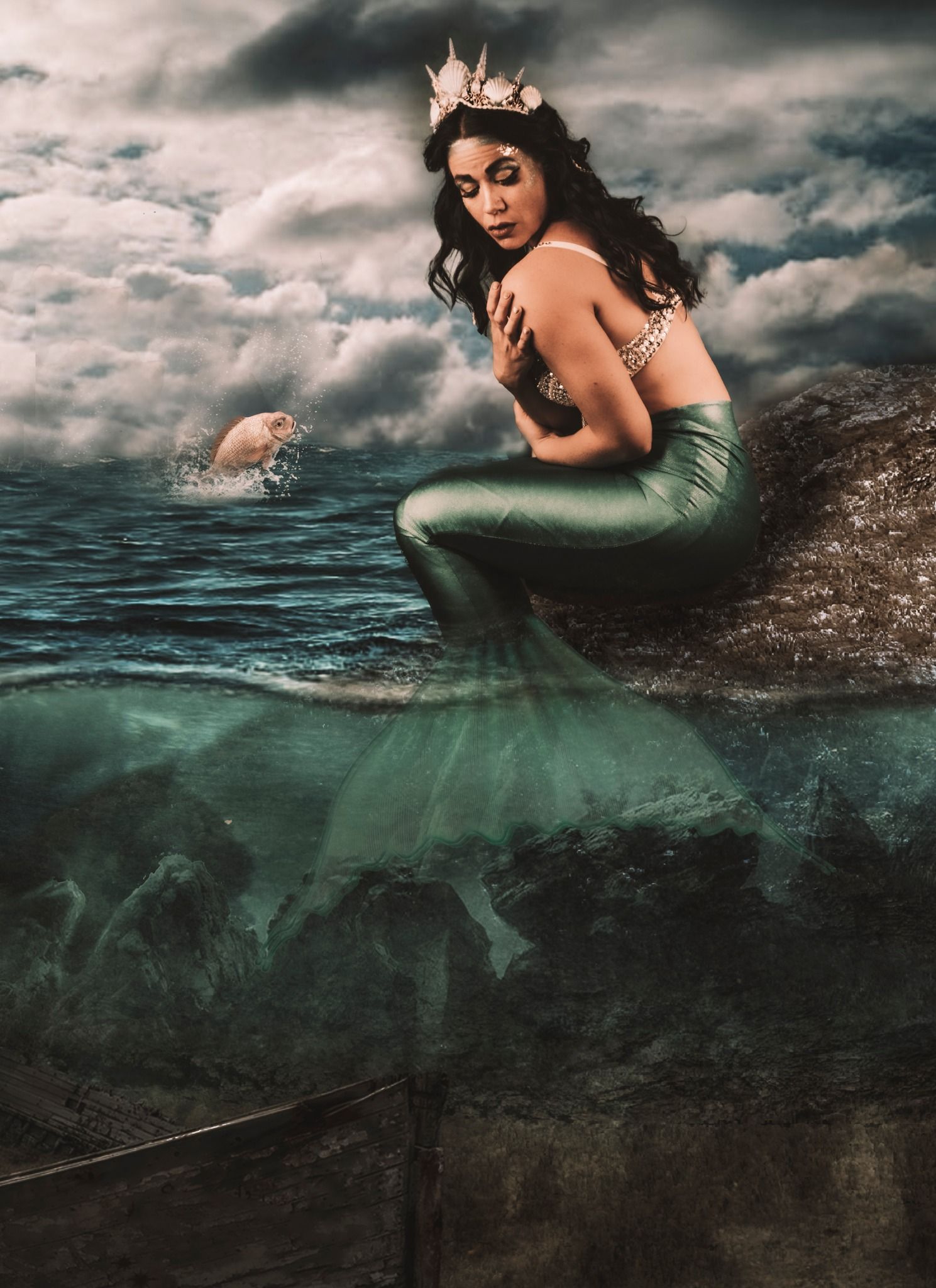 Ethereal underwater photography series featuring teal tones and dramatic cloudy skies reflecting in dark waters.
