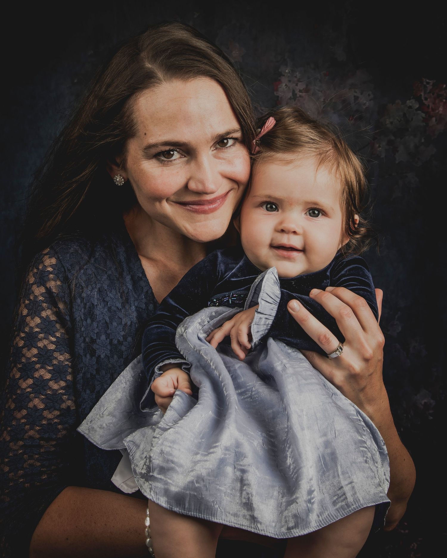 A tender moment shared against a dark background as they pose together in a four-photo sequence.