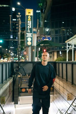 Nighttime urban photography series on illuminated city steps with modern buildings in background.