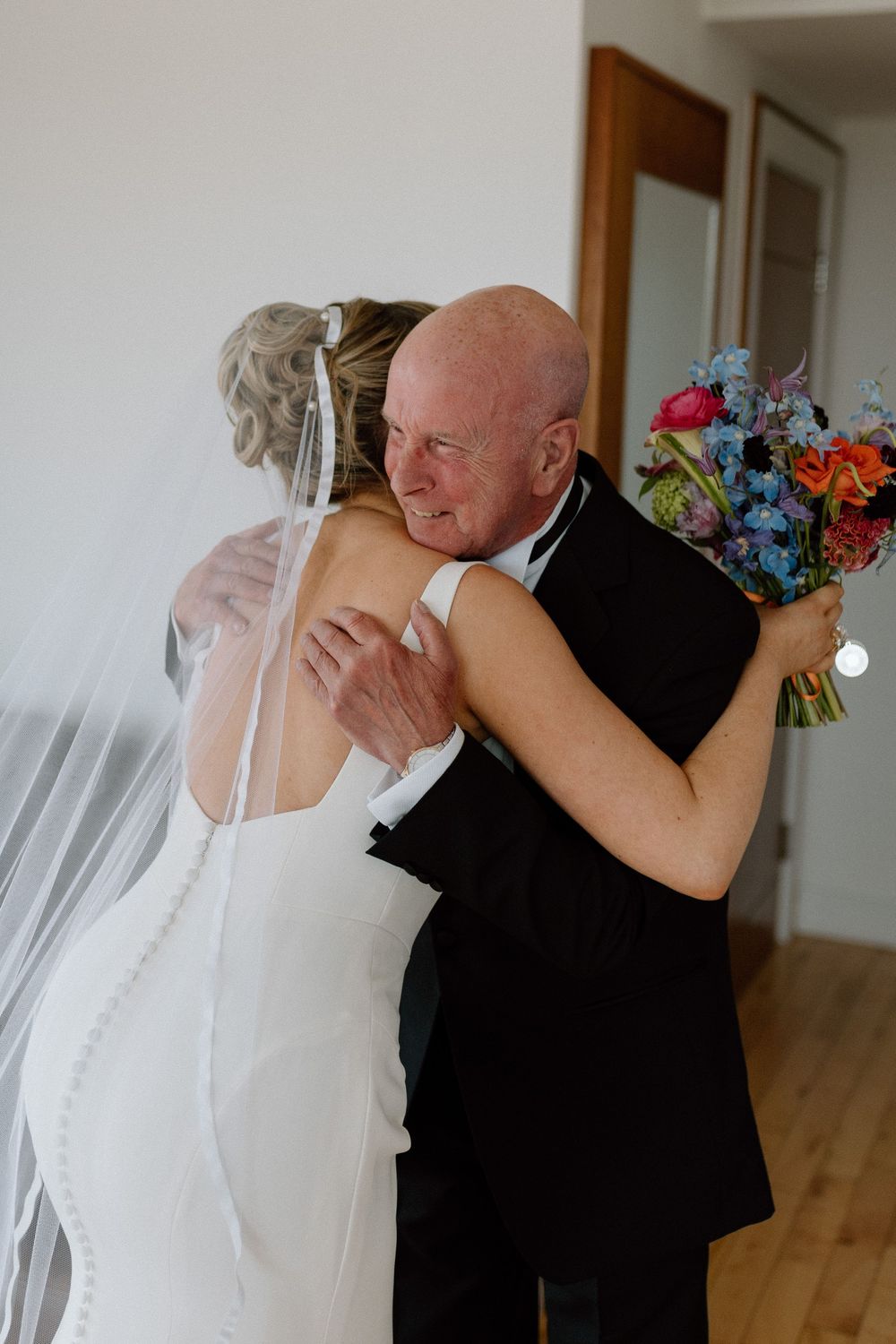 Father of the bride greets his daughter at a Liverpool wedding.