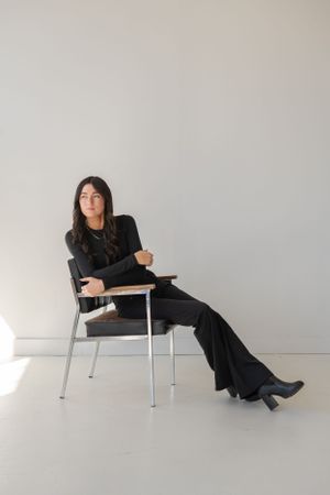 Series of artistic poses on minimalist chair showing contemporary style and movement.