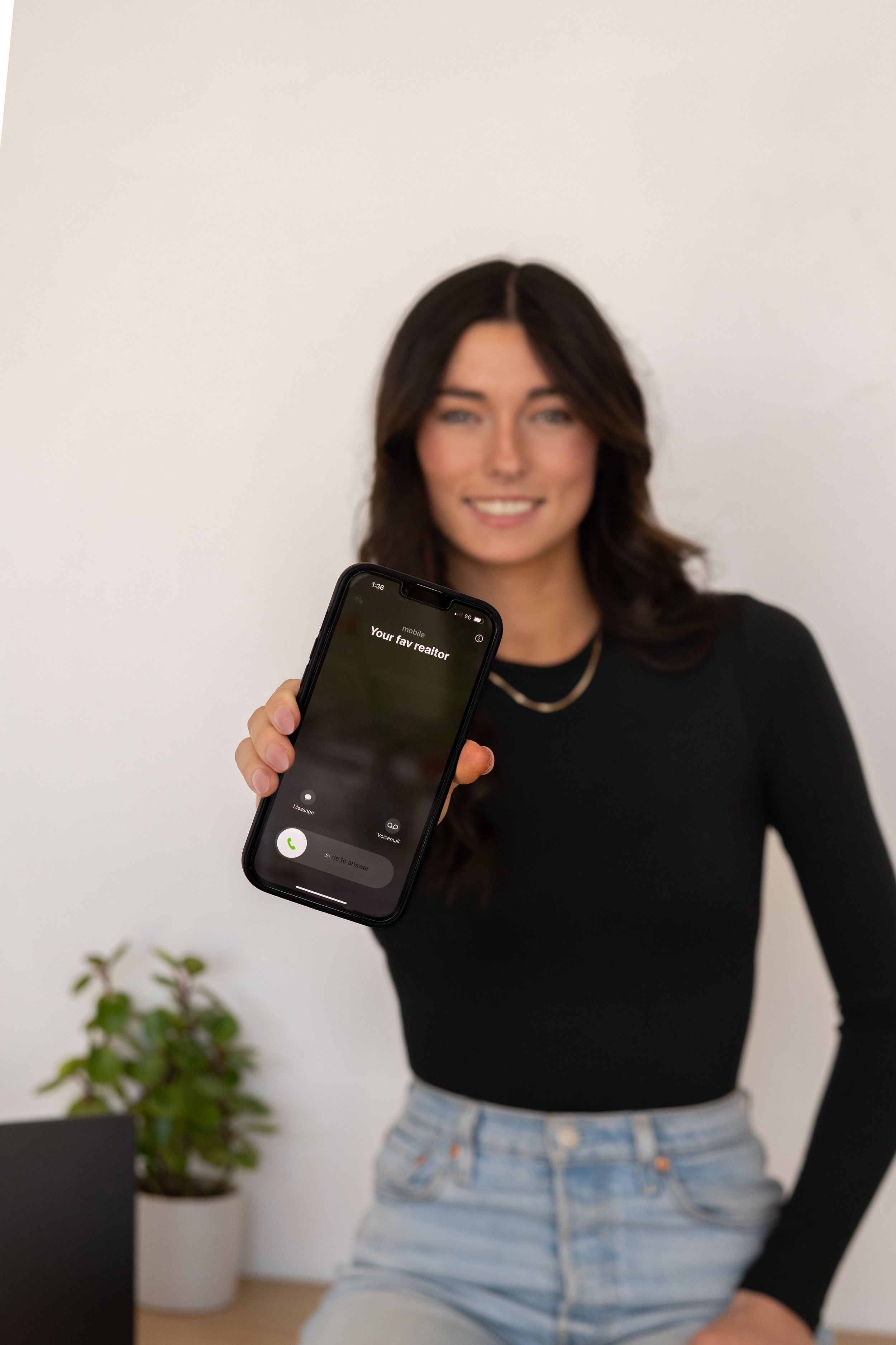 Product photography setup showing mobile devices against white background with casual styling.