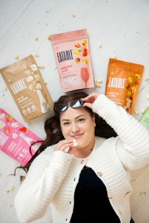 Flatlay product photography featuring colorful snack packaging on white background.