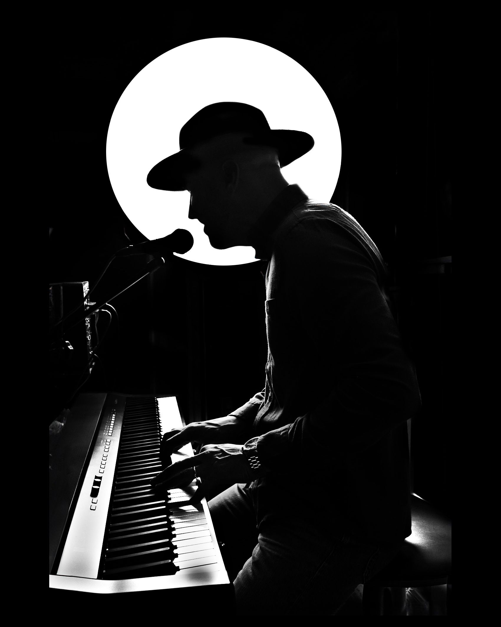 Silhouetted musician in a hat plays piano against a bright circular light backdrop in dramatic black and white.