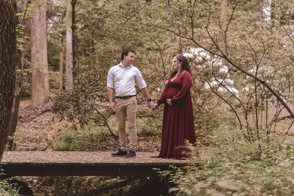 Father and mother walking together during a maternity lifestyle session in Charlotte, North Carolina