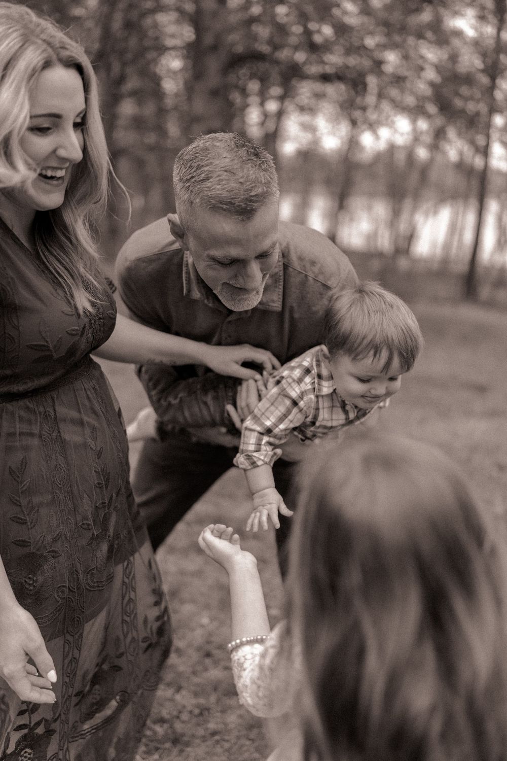 Close up black and white portrait of a playful family in the park in Charlotte, North Carolina