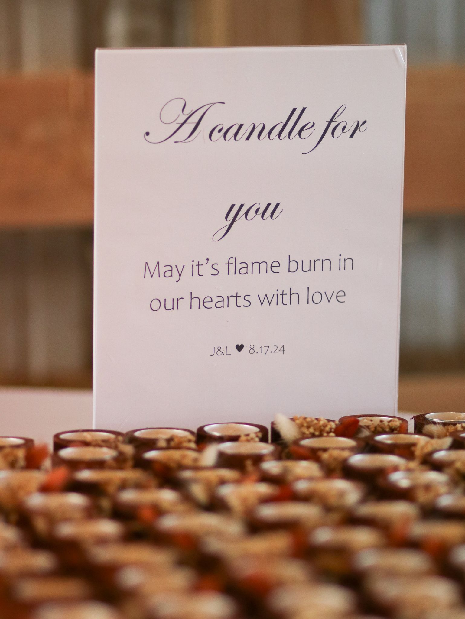 Wedding favor card with romantic candle message displayed with decorative elements.