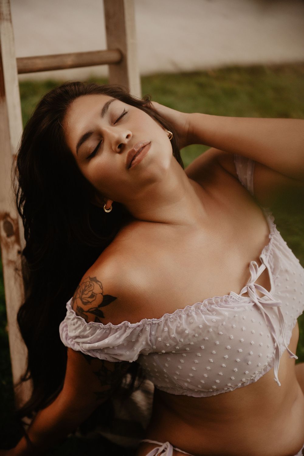 Backyard Utah Boudoir photoshoot with cottagecore vibes. Apple Picking female model with a bright and airy vibe.
