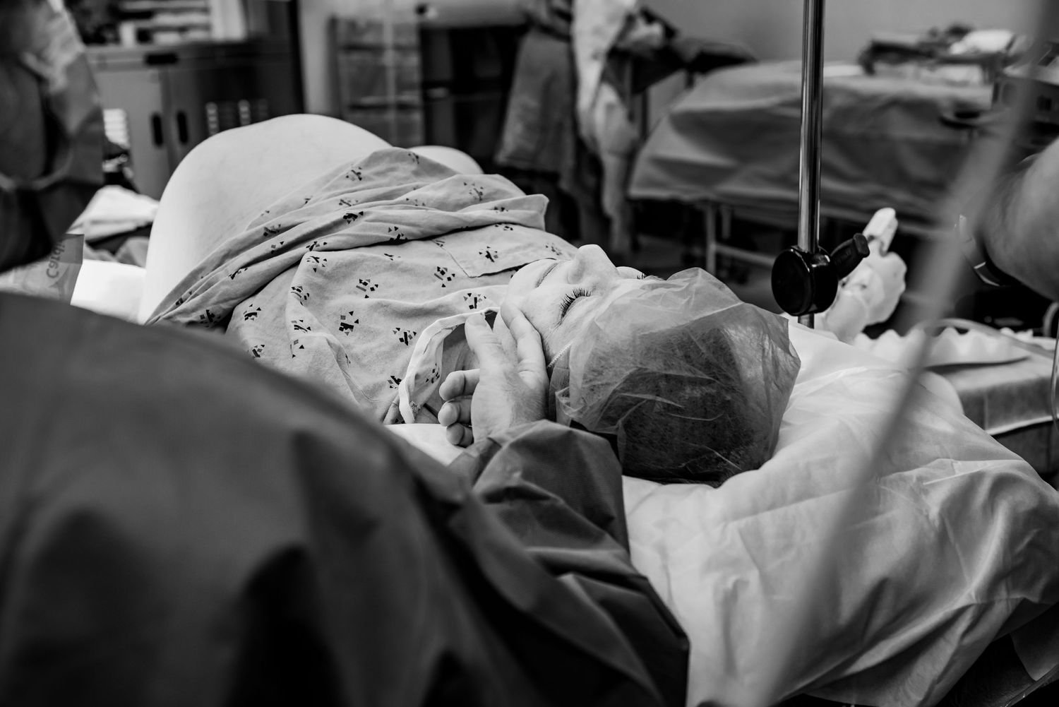 A black and white image captures a getting ready for a c-section