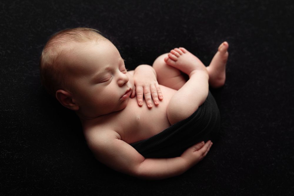 Newborn baby in neutral palette, black background, timeless style, Katy Houston newborn photography | Paloma Schell newborn photographer