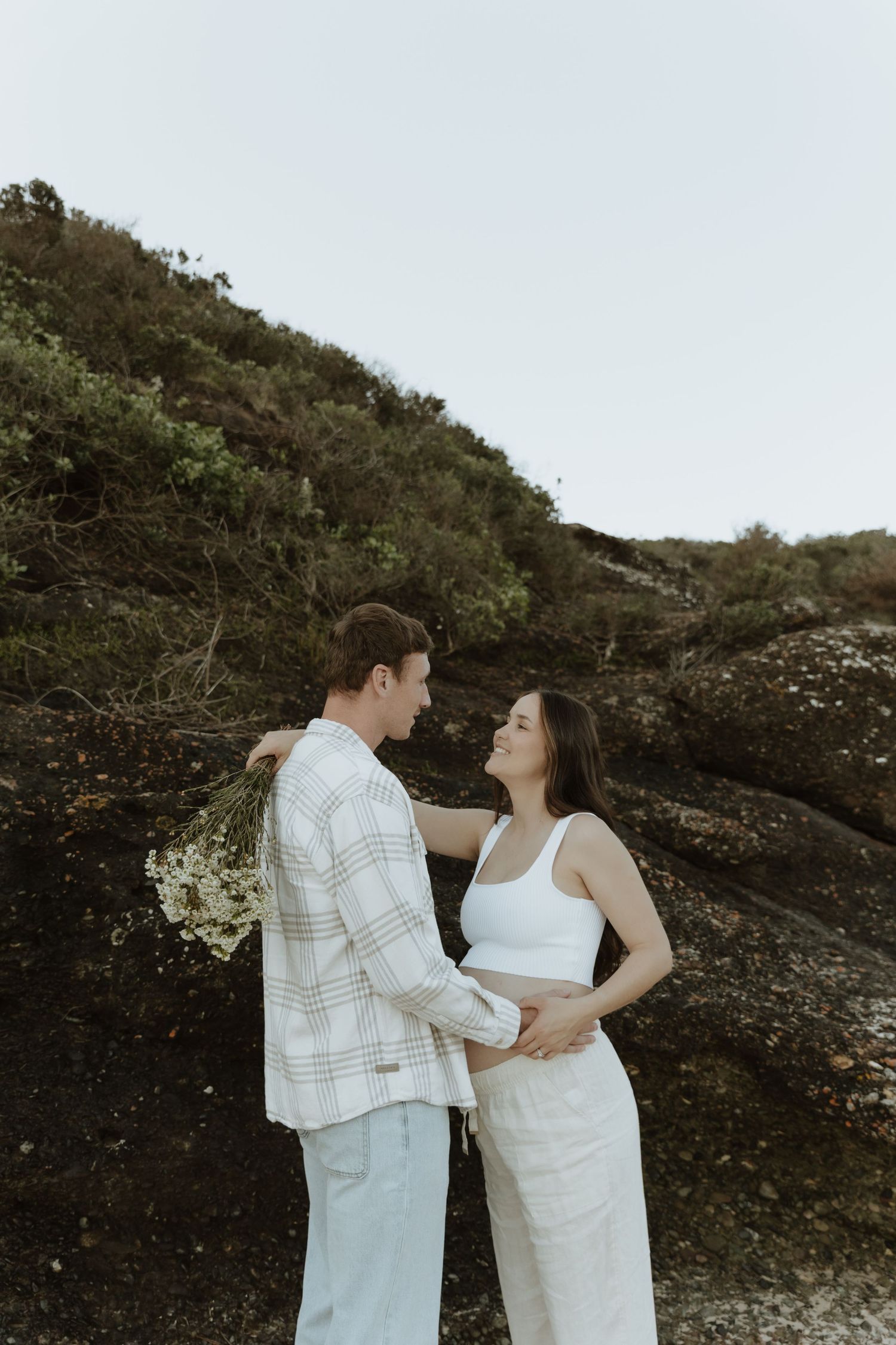 Cosy & connected maternity photos on the beach in Lake Macquarie NSW