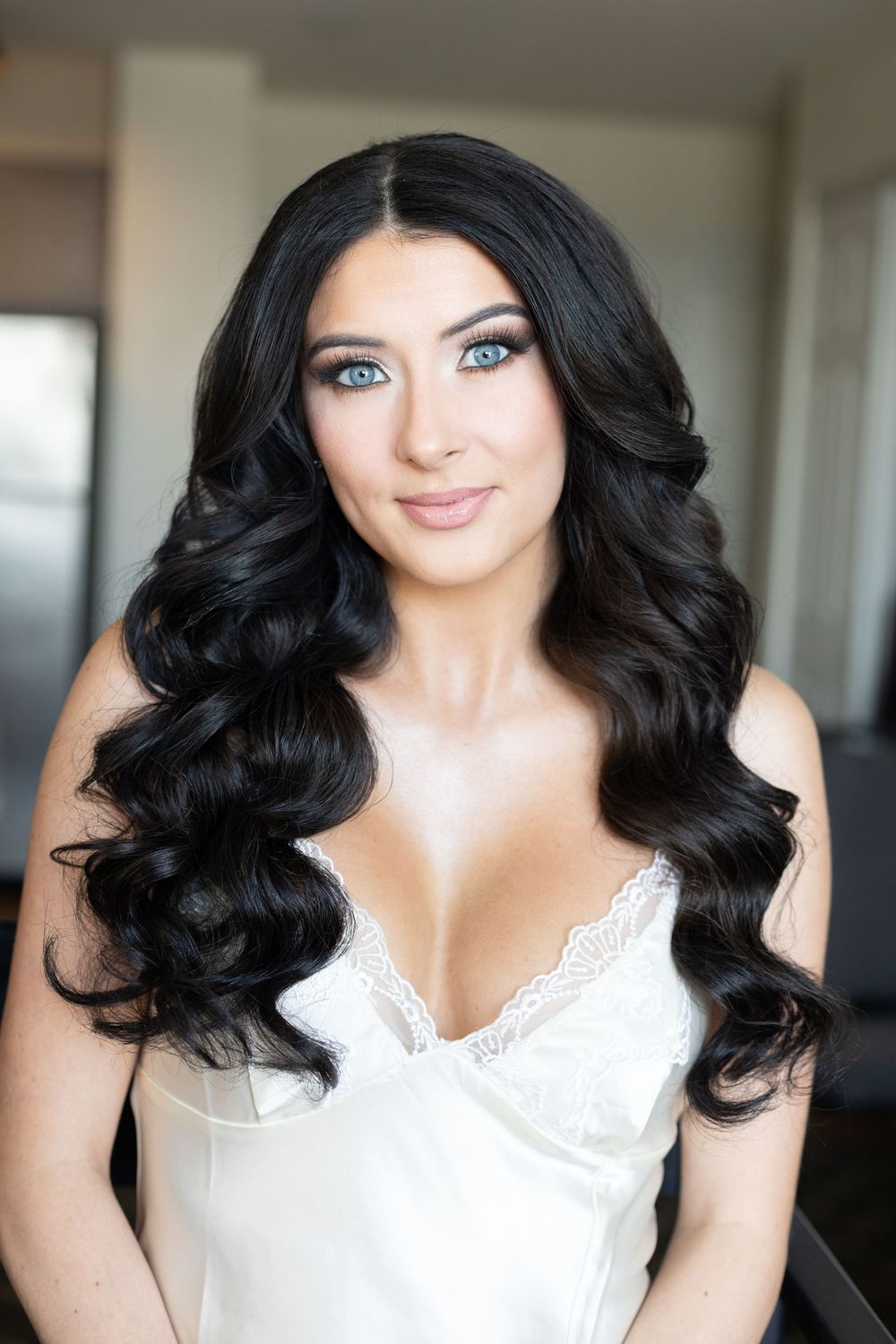 Beautiful bride portrait with glamorous makeup and soft curls while getting ready for her Glen Island Harbour Club wedding in New Rochelle,