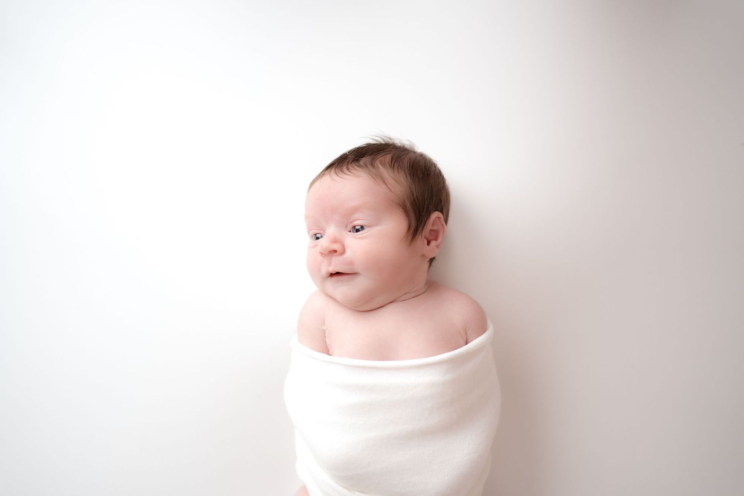 Studio newborn baby portrait on a clean white background