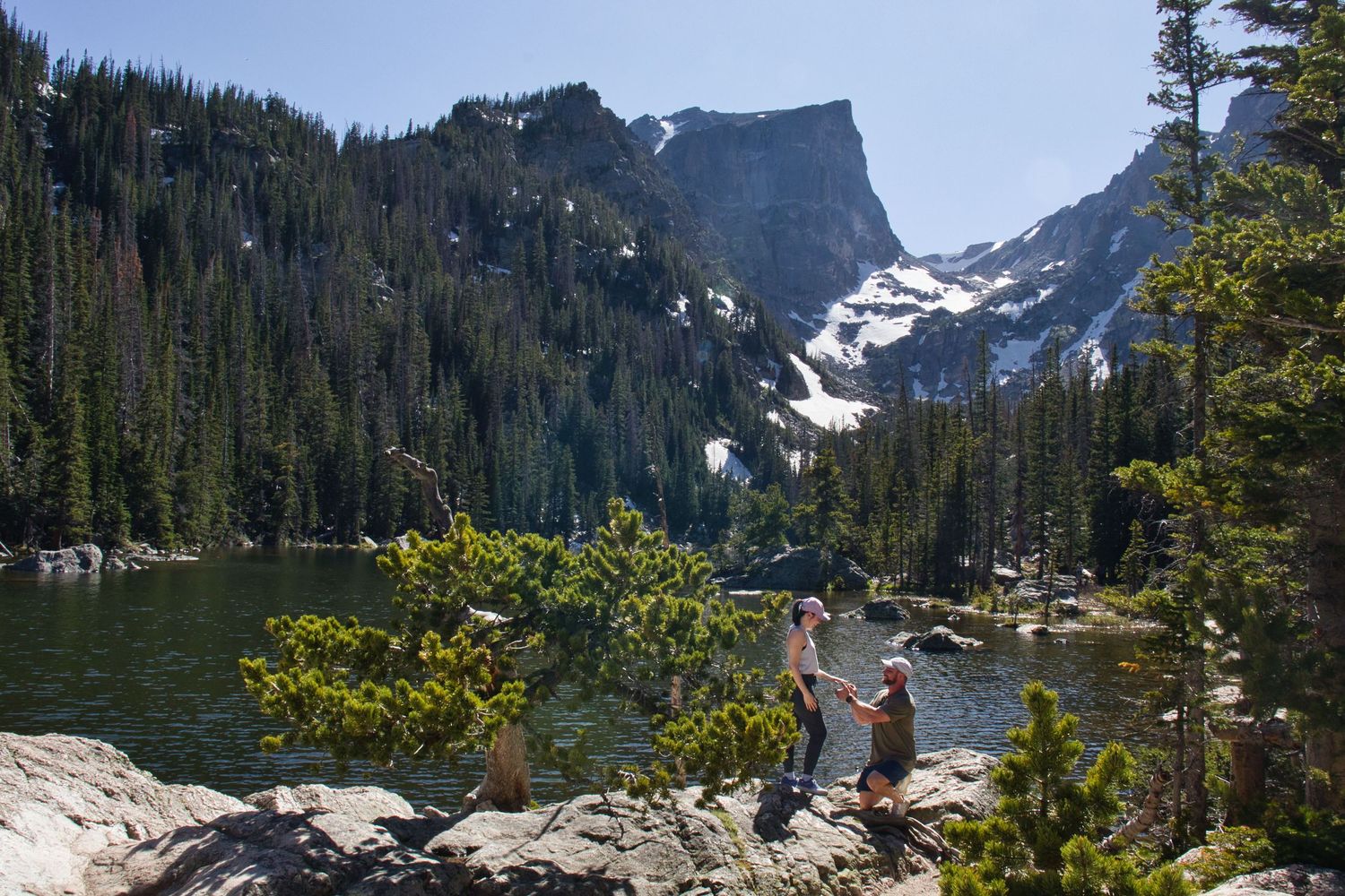Couple proposal at Dream Lake. Pixcapades | The Rocky Mountain Proposal Photographer