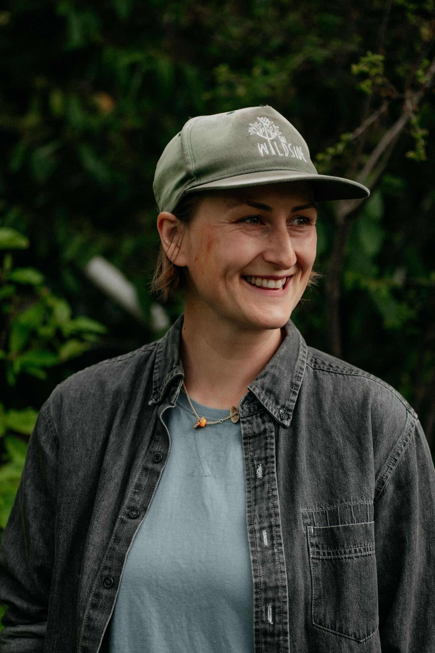 Woman smiling, headshot in nature