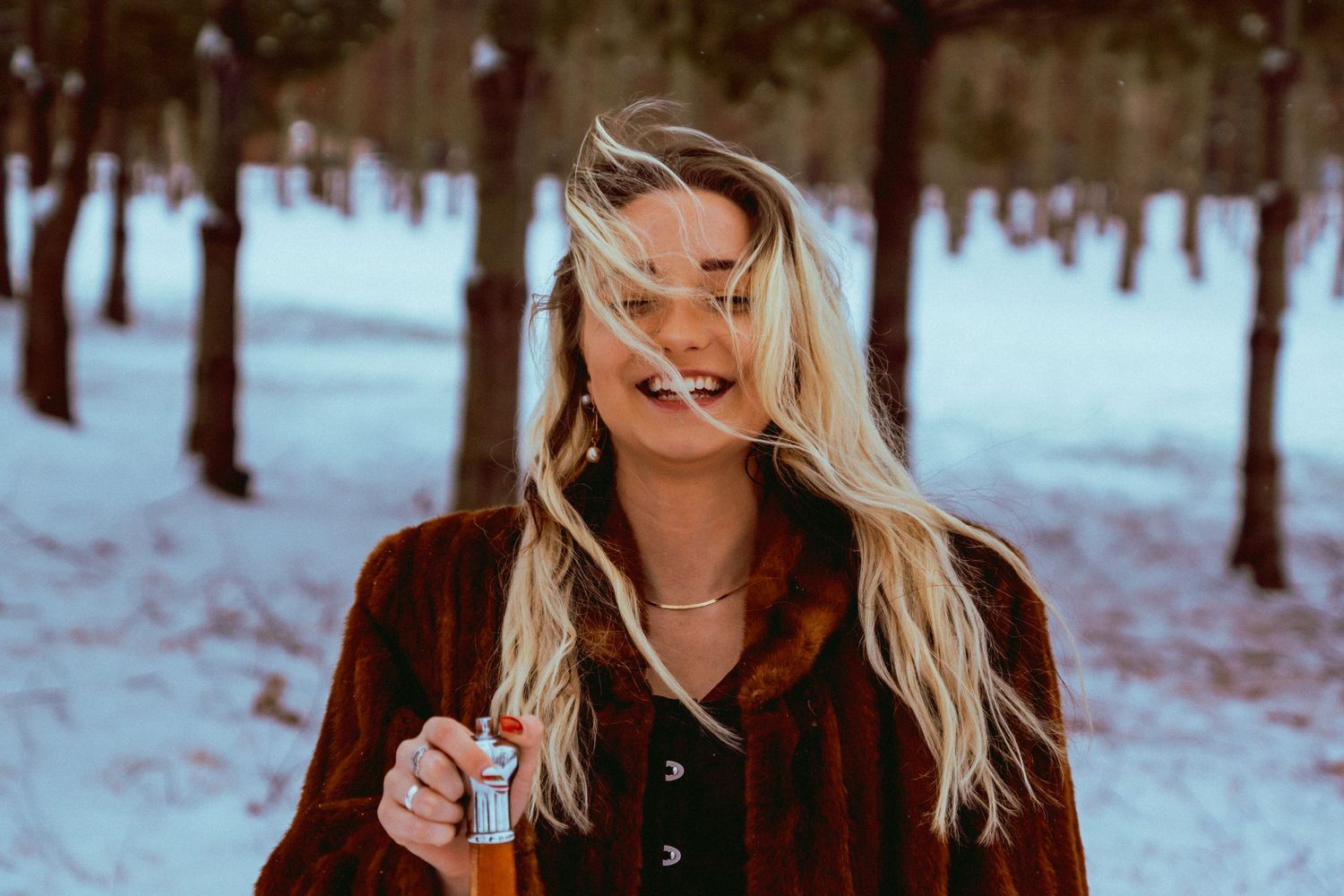 Model laughing at fantasy snowy session in Bowling Green, Kentucky