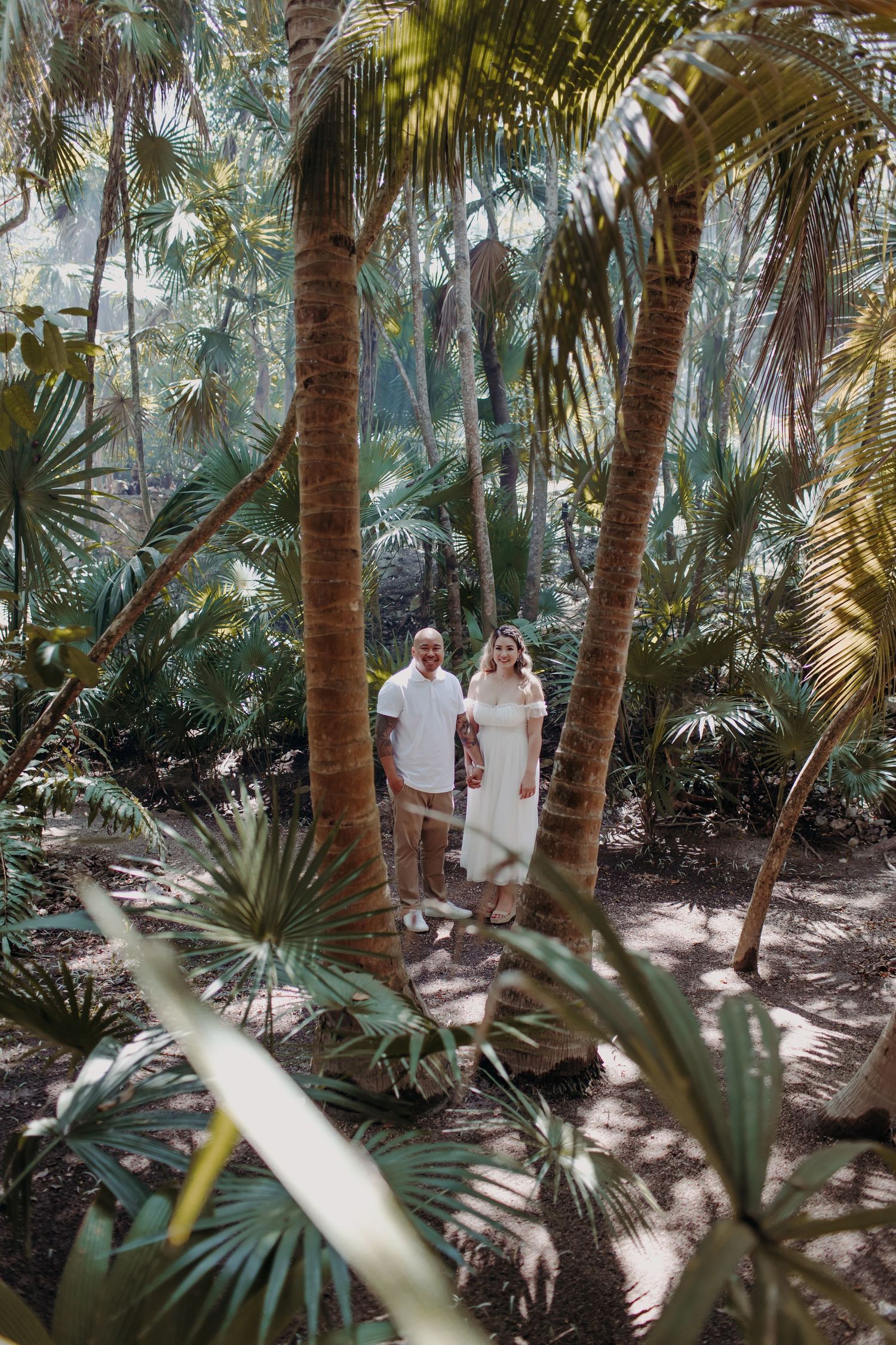 Couple in a cenote session engagement in the jungle