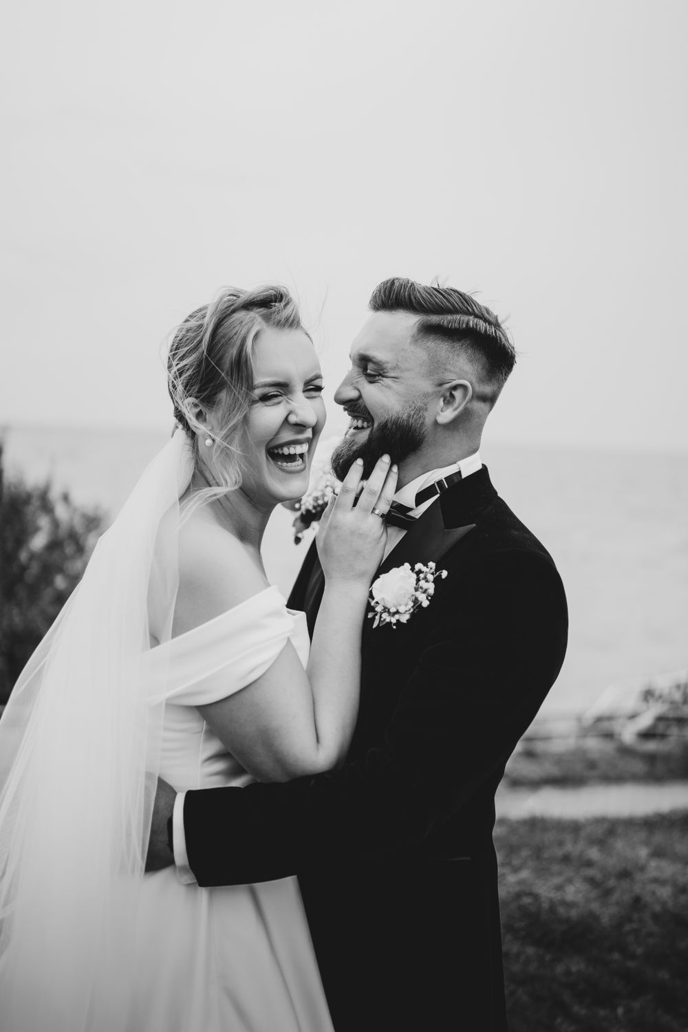 Black and white candid wedding photos capturing genuine laughter and joy.
