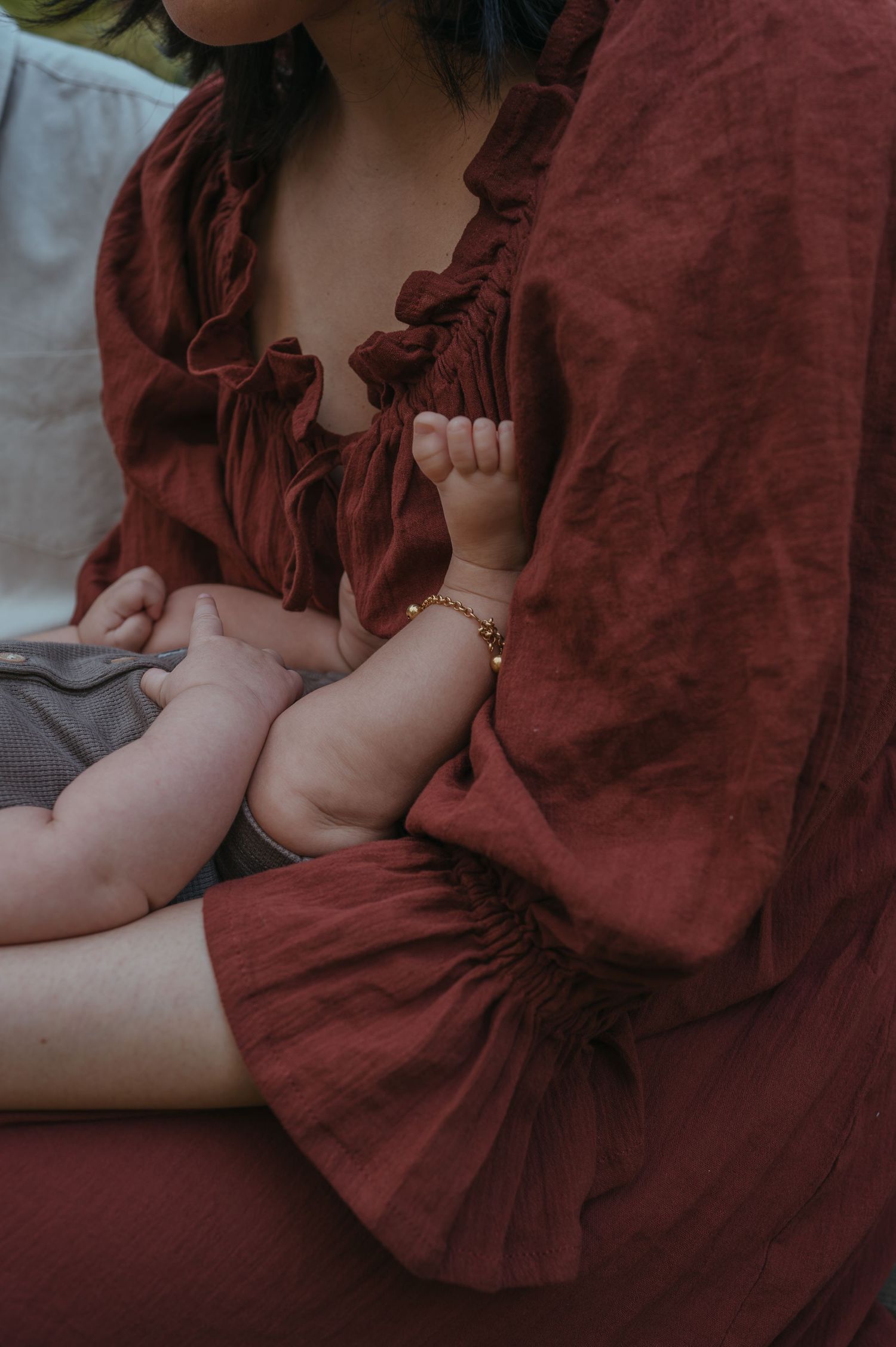 Mum holding baby. Little toes sitting on mum's chest are in shot - Dandenong