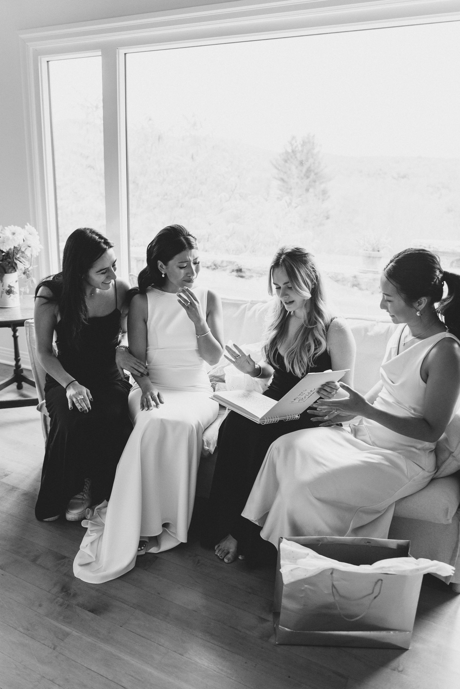 Black and white photo series capturing laughter and celebration in a sunlit room.
