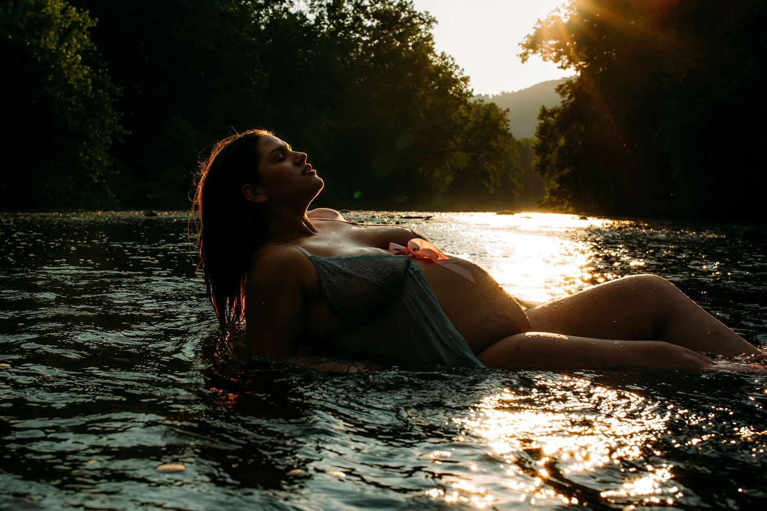 Mountain engagement photos with dramatic landscape views and a red dress.