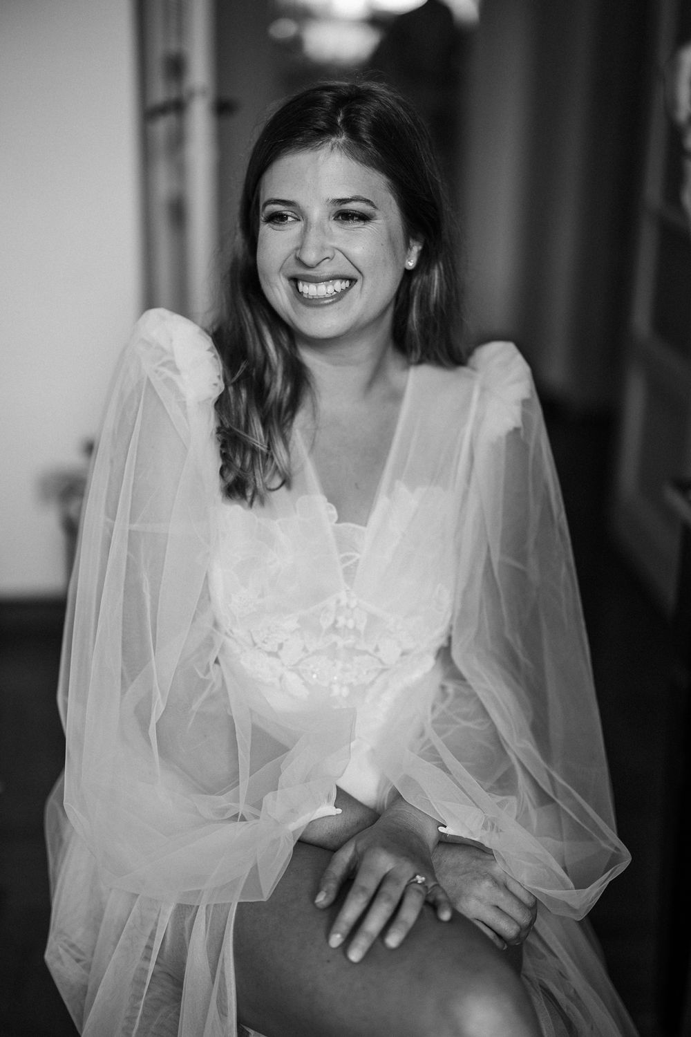 Black and white portrait series of a bride in flowing white dress.