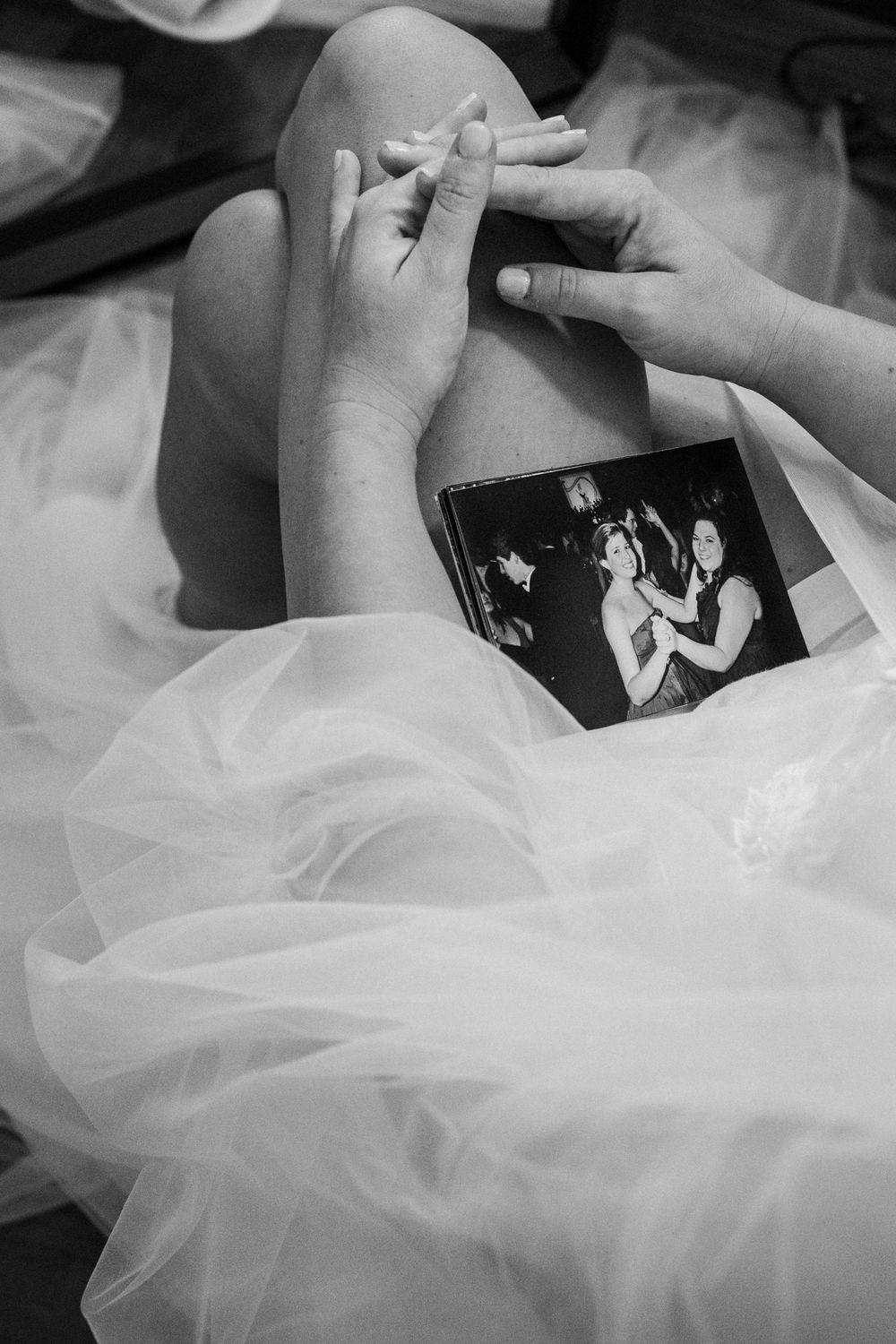 Close-up black and white shots of intricate bridal dress details.