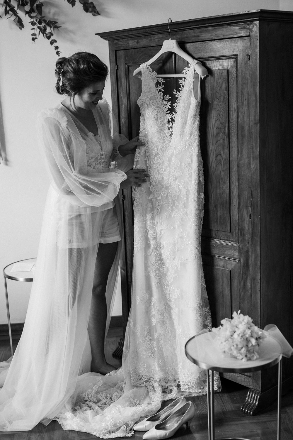 Series of moments showing bride examining her wedding dress before the ceremony.