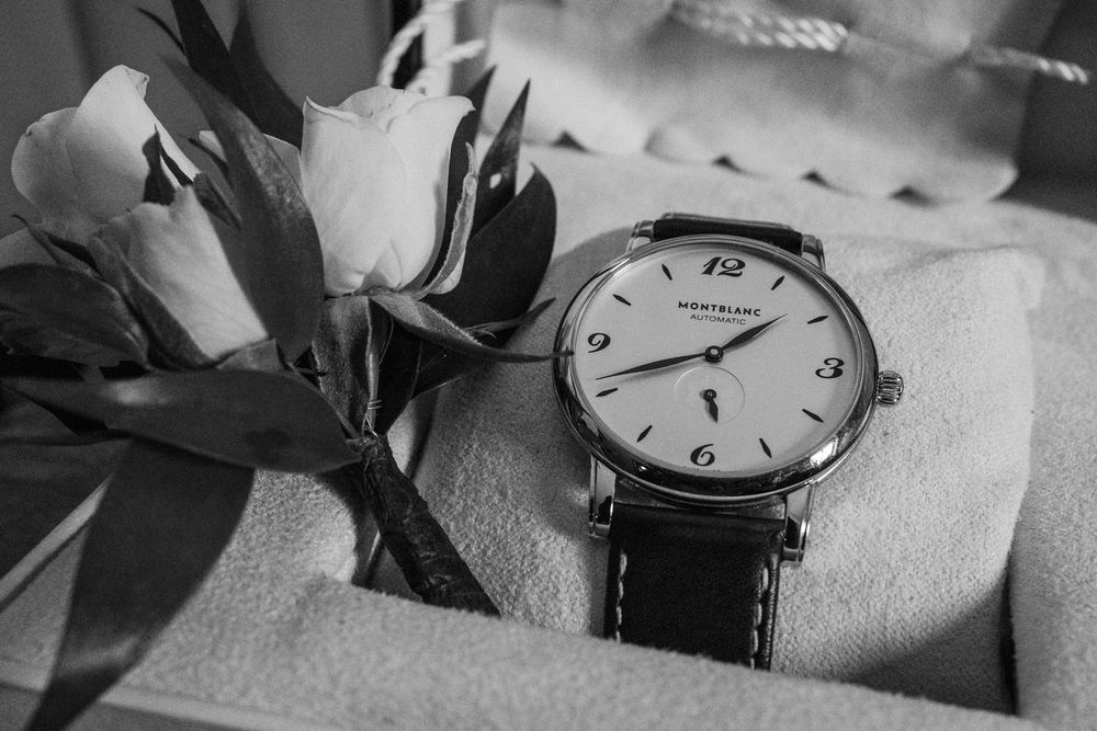 Close-up detail shots of vintage-style watches and timepieces arranged artistically in black and white.